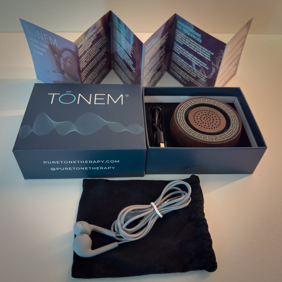 What is in the box: TŌNEM with the guide, wired headphones, charging cable, and travel bag